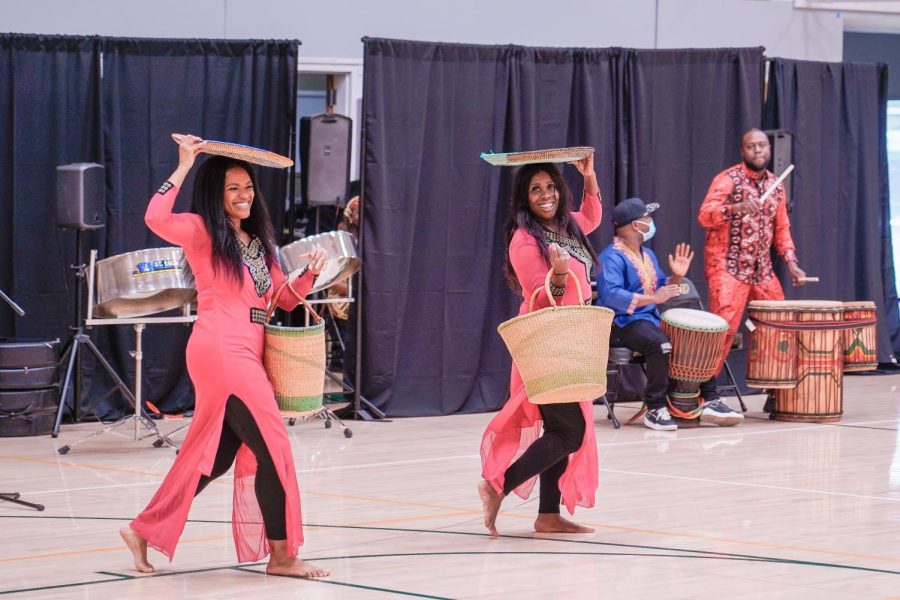 CELEBRATIONS Performers from Oriki Arts explore the African Diaspora in a recent assembly for Pinewood School Upper Campus students, faculty, and staff. Performances included a retelling of the Diasporas history and steelpan drums.