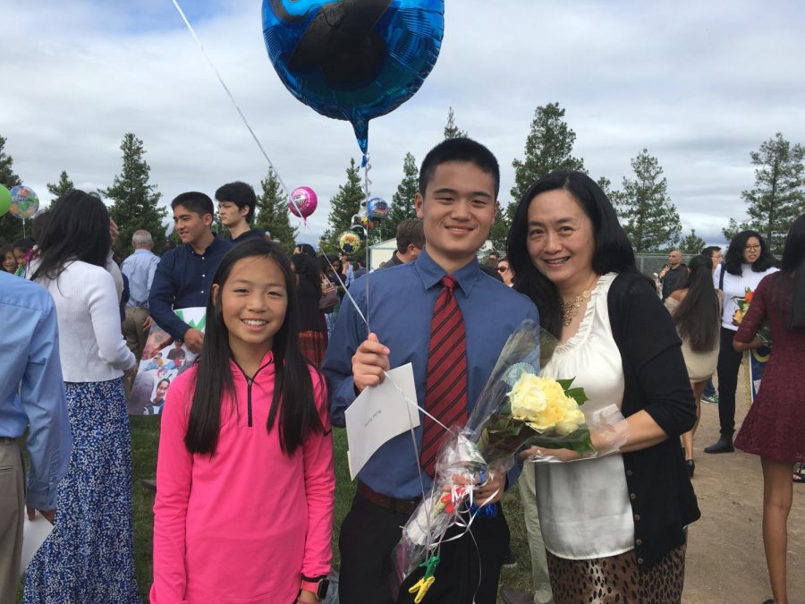 Taken June 8, 2017 (6th grade) at my brothers 8th grade graduation. From left to right: me, my brother, and my mom.