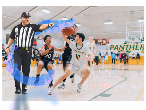 Pinewood boys basketball player Kayden Ge (right) fakes out the ref for a finish at the basket.