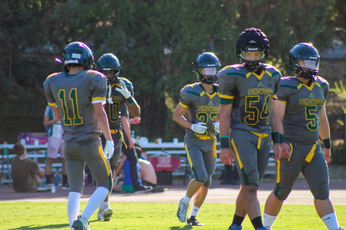 The football team runs onto the field for an offensive posession