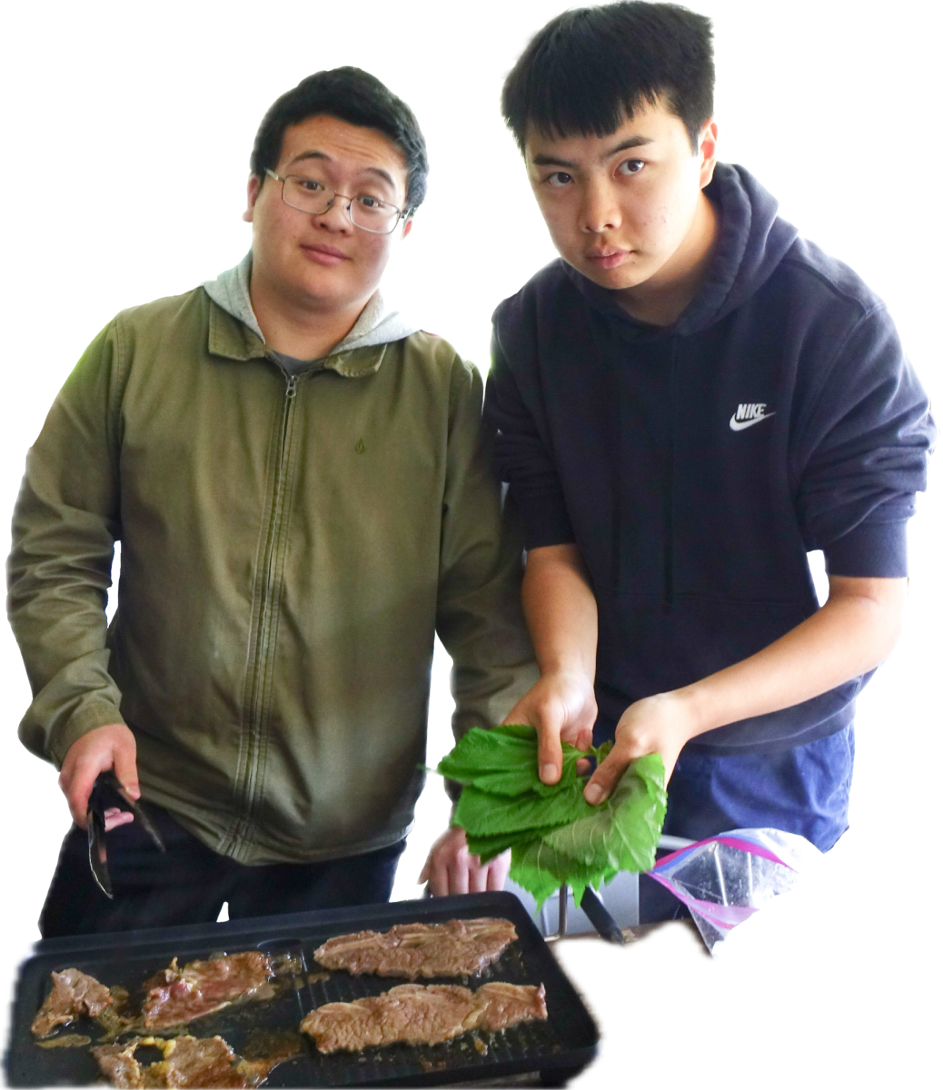 Young and Chin cook on the Murphy Patio.