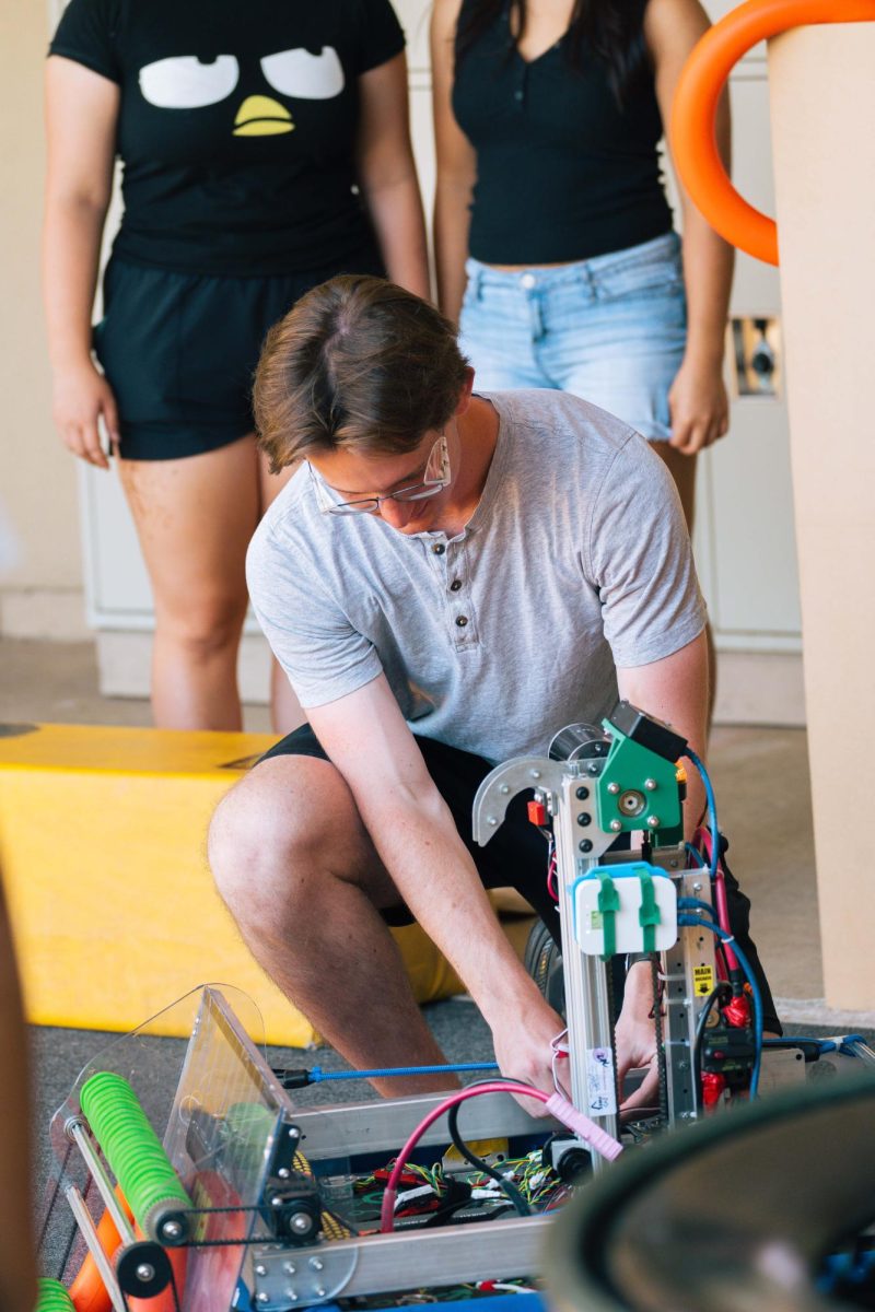 Bowman prepares a robot for testing.