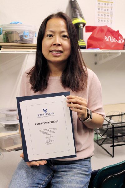 Tran with her fellowship award.
