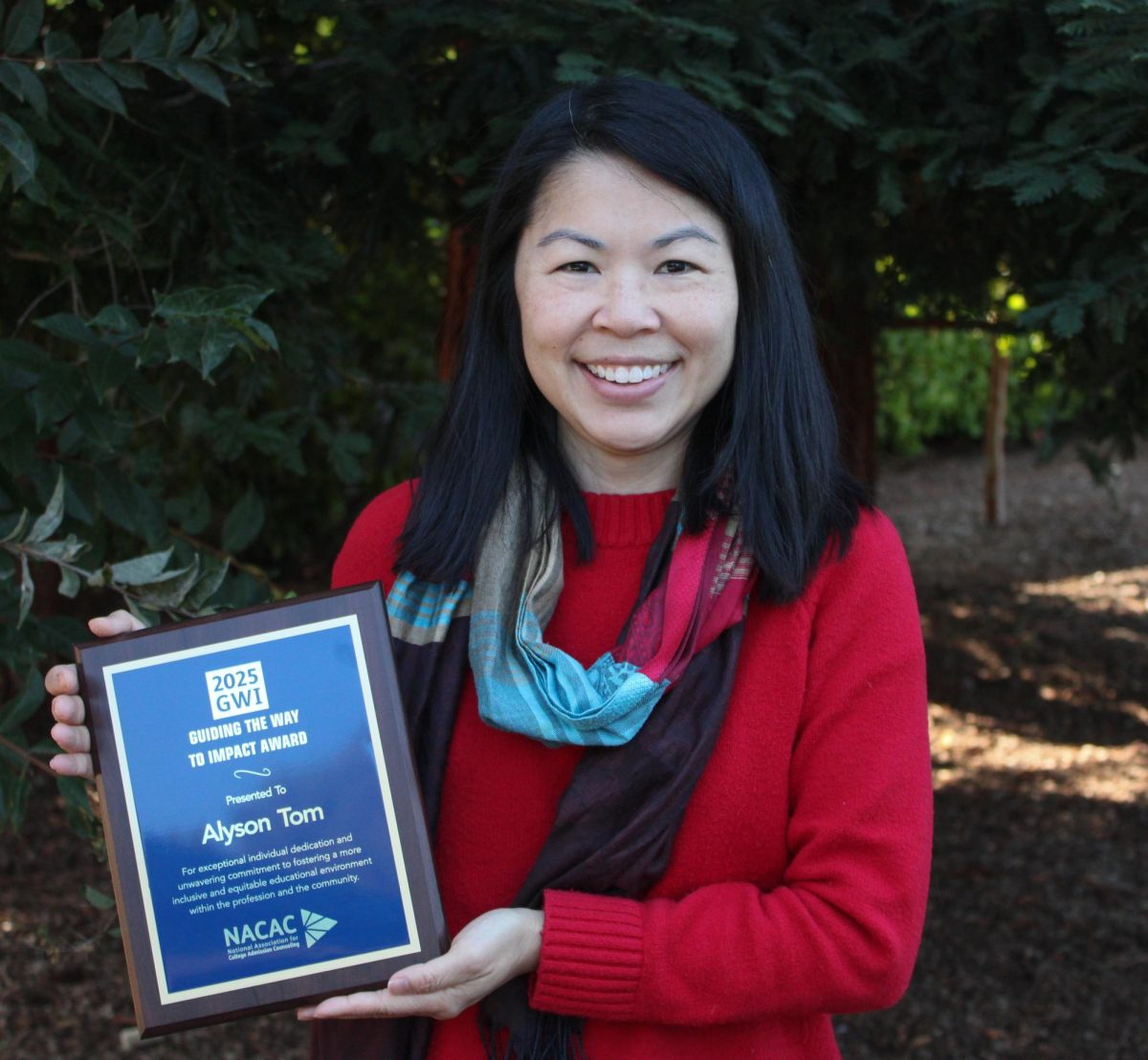 Alyson Tom shows off her NACAC award