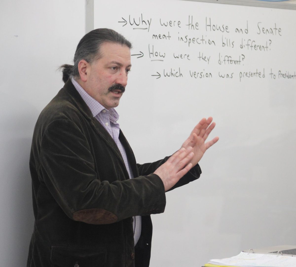 Ghassemi lectures during a U.S. history class. 